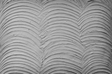 texture of the gray polished concrete wall with scratchesの写真素材