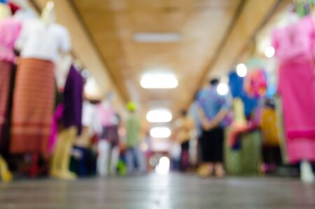 Blurred background : people shopping at market fair in sunny day, blur background with bokehの写真素材