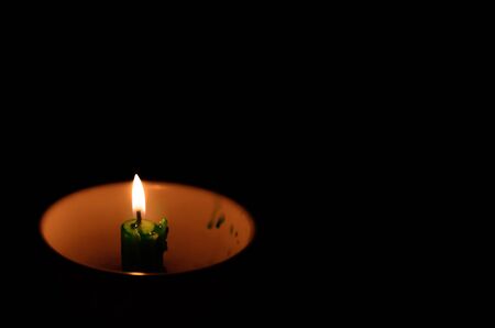 Burning candles in cupsの写真素材