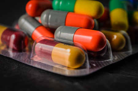 pharmaceutical drug brothel on a background of black stone.の写真素材