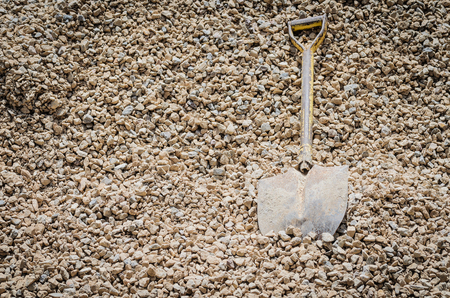 shovel with stone pileの写真素材