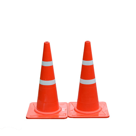 orange cones on street,old traffic cones on white background.の写真素材