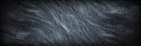 panorama shot of dark grey black slate stone background.の写真素材