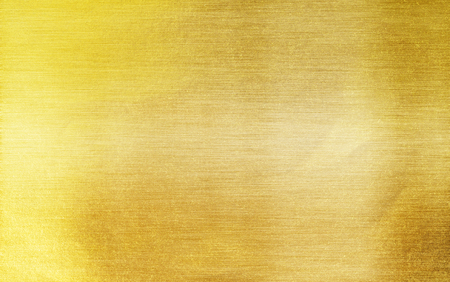 Gold paper texture or Shiny yellow leaf gold foil texture backgroundの写真素材
