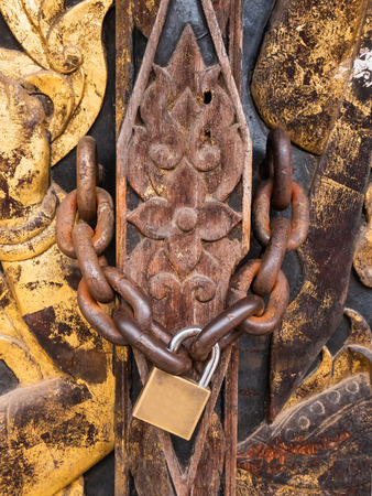 door locked close up Thai carved doors woodの写真素材