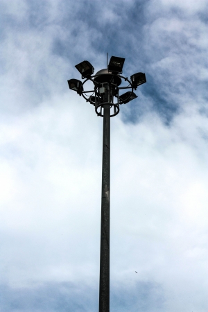 Spot-light tower against the blue sky