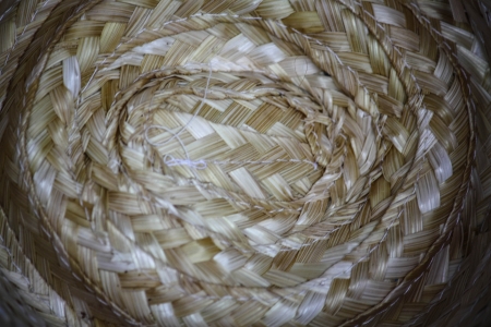 Top view of a round straw hat on  background.の写真素材
