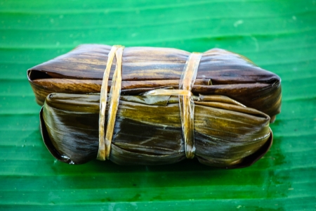 Thai style dessert, made from banana and glutinous rice, wrap with banana leafの写真素材