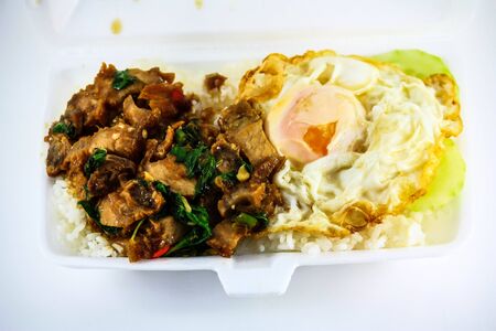 Thai food, kapao moo, minced pork fried with chilli pepper and sweet basil  Close-up with shallow depth of field の写真素材