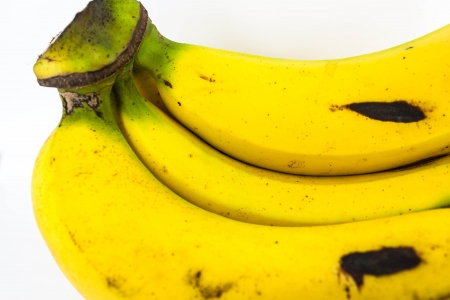 banana is yellowwingcooked lay on white backgroundの写真素材