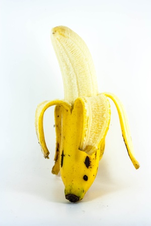 banana is yellowwingcooked lay on white backgroundの写真素材