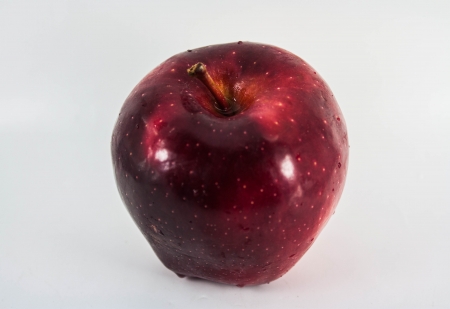 Red Apples with green leaf on whiteの写真素材