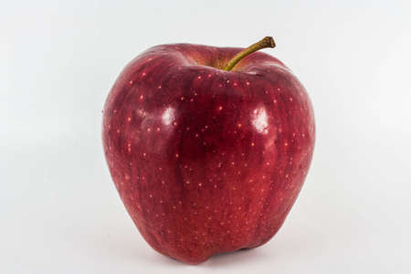 Red Apples with green leaf on whiteの写真素材