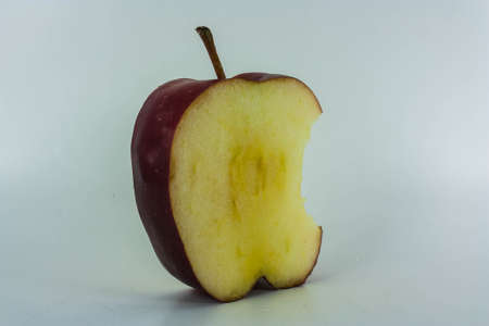 Red Apples with green leaf on whiteの写真素材