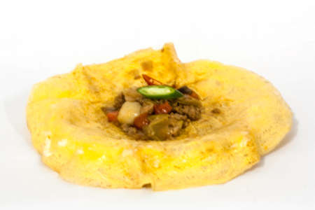 scrambled eggs with fresh herbs on a white background