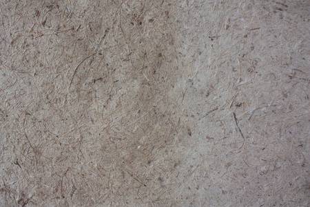 Closed up brown mulberry paper with wood pulp background.