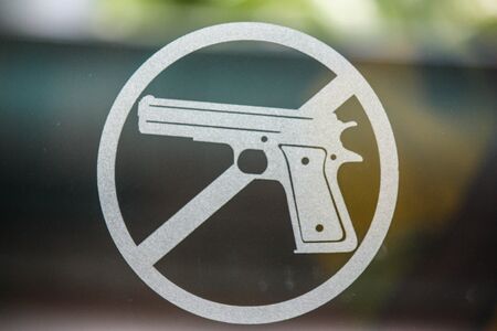 No guns message written on a blackboardの写真素材
