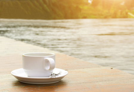 coffee cup On the table A sun shines vintage color stylesの写真素材