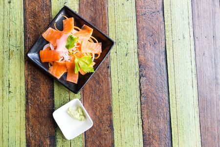 Sashimi Salmon chopsticks dipping sauceの写真素材