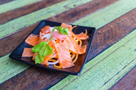 Sashimi Salmon chopsticks dipping sauceの写真素材