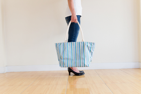 Woman wearing jeans High heels Shopping bagの写真素材