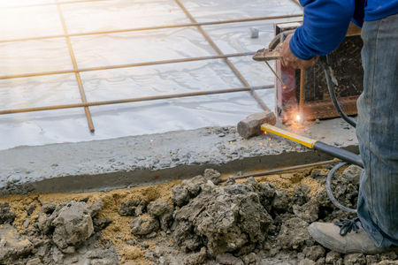 Construction workers building the foundation of a building.の写真素材
