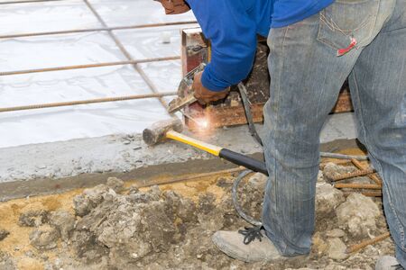Construction workers building the foundation of a building.の写真素材