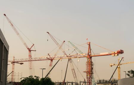 Building construction cranes and Skyscraper construction Many Cranesの写真素材