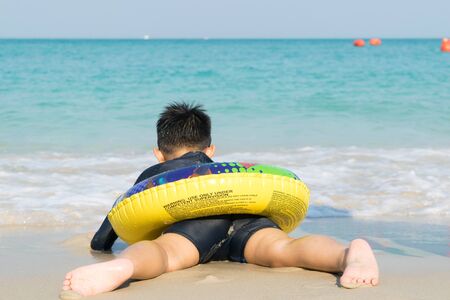 The boy put Snorkeling Dive into the seaの写真素材