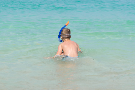 The boy put Snorkeling Dive into the seaの写真素材