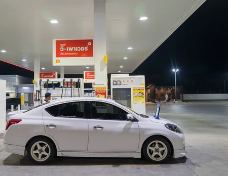 Thailand Cars in for fuel at a Shell gas station.のeditorial素材