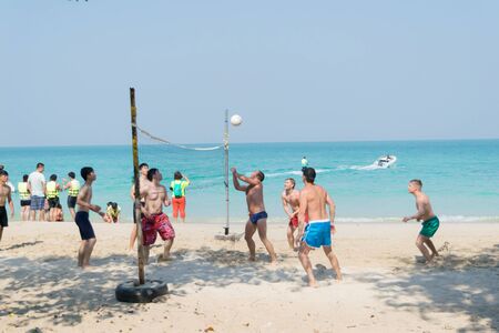 Chonburi Sai Kaew Beach people relaxing by the ocean and beach activities such as volleyball.のeditorial素材