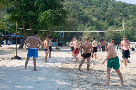 Chonburi Sai Kaew Beach people relaxing by the ocean and beach activities such as volleyball.のeditorial素材
