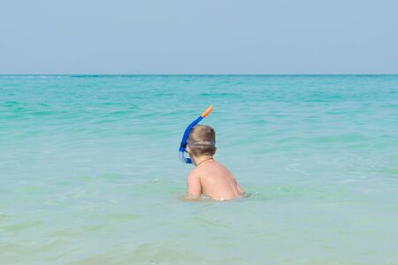 The boy put Snorkeling Dive into the seaの写真素材