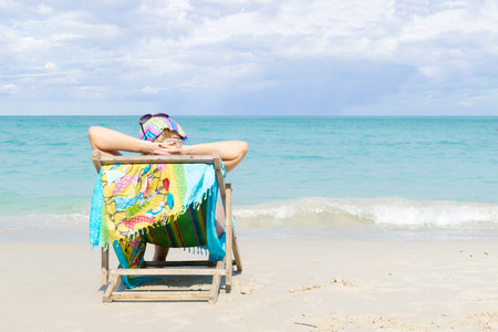 Women sunbathing on the beach Sky and seaの写真素材