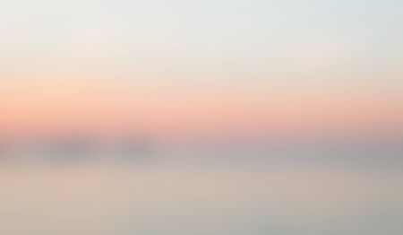 Smooth light blue green Orange evening blurred background.の写真素材