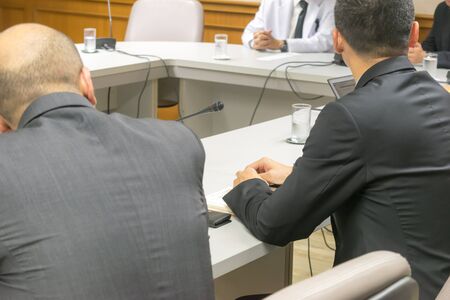 People attend business meetings in the conference room.の写真素材