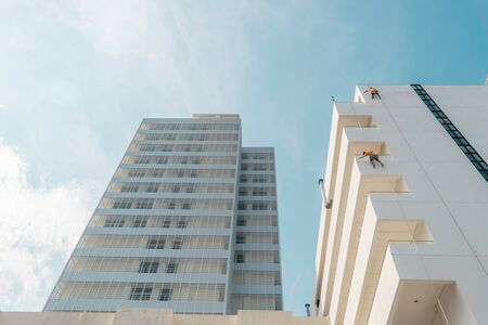 Buildings against the blue sky on a sunny day.の写真素材