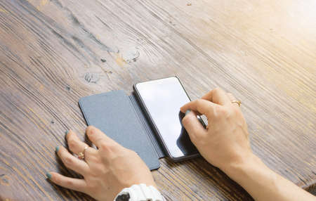 woman holding of mobile phone and smartphone.の写真素材