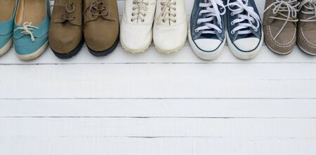 The shoes are placed on a white wooden floor.の写真素材