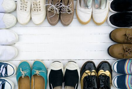 The shoes are placed on a white wooden floor.の写真素材