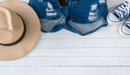 Dress Accessories women Jeans and hats sunglasses shoes on a white background.