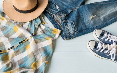 Accessories costume clothes Jeans and hats sunglasses shoes on Wooden floor background.の写真素材