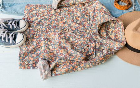 Accessories costume clothes Jeans and hats sunglasses shoes on Wooden floor background.の写真素材