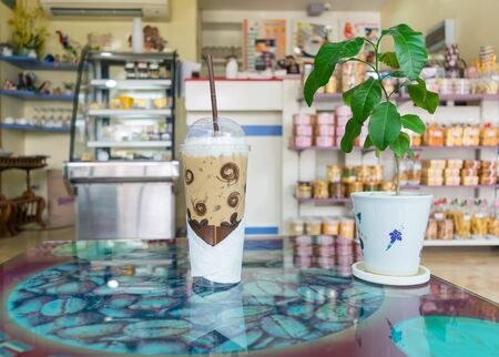 ice coffee on a table in a coffee shopの写真素材