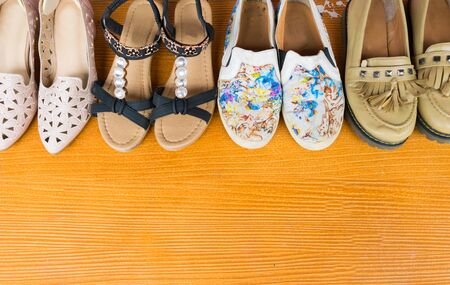 Shoes are placed on a wooden floor.の写真素材