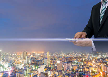 Businessmen hold a smartphone with digital pattern to view socialの写真素材