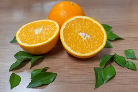 Oranges healthy fruit is placed on wooden floor.の写真素材