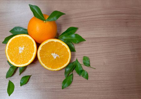 Oranges healthy fruit is placed on wooden floor.の写真素材