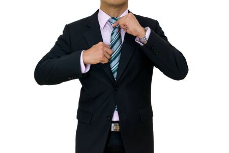 businessman put on a black suit necktie White background of isolatedの写真素材